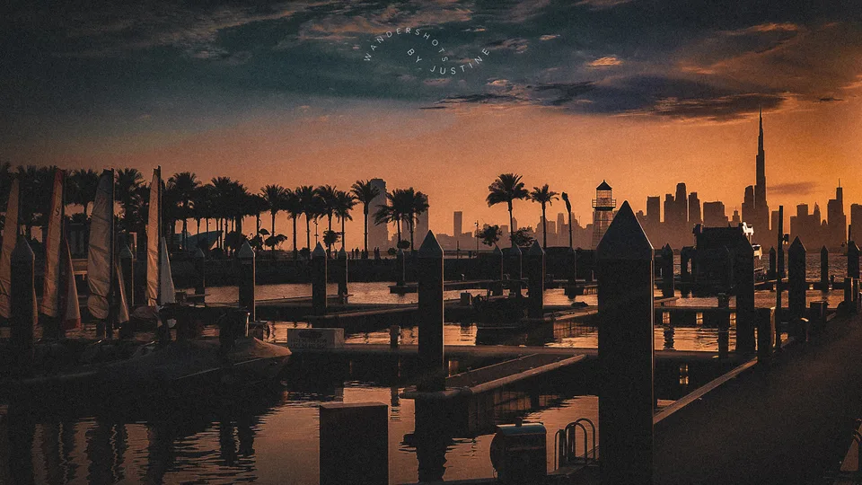 Dubai Creek Harbour towers at sunset across the water