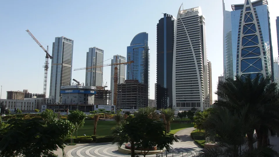 Park lawn and high-rise towers at Jumeirah Lake Towers